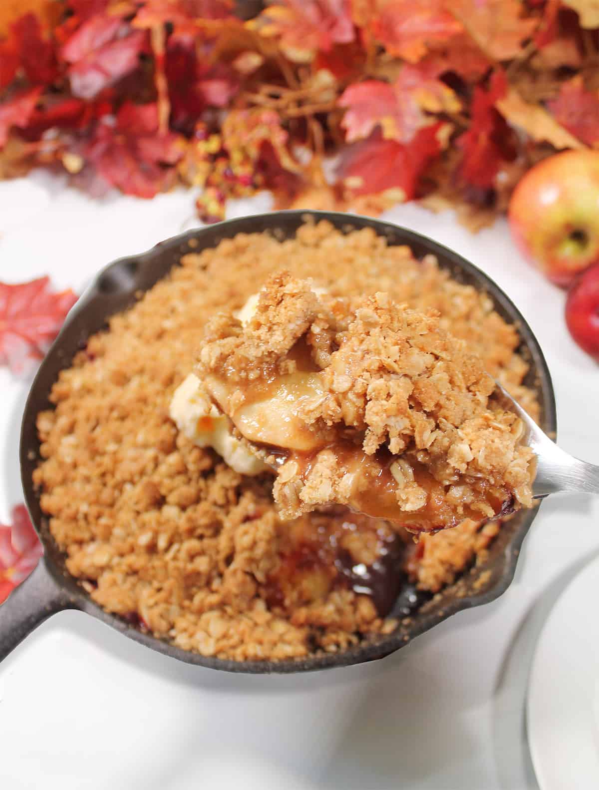 Scooping out a serving from skillet.