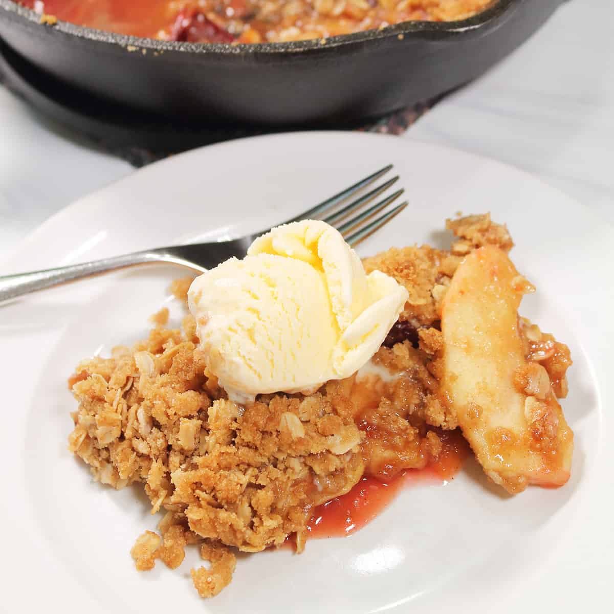 Serving on plate topped with ice cream.
