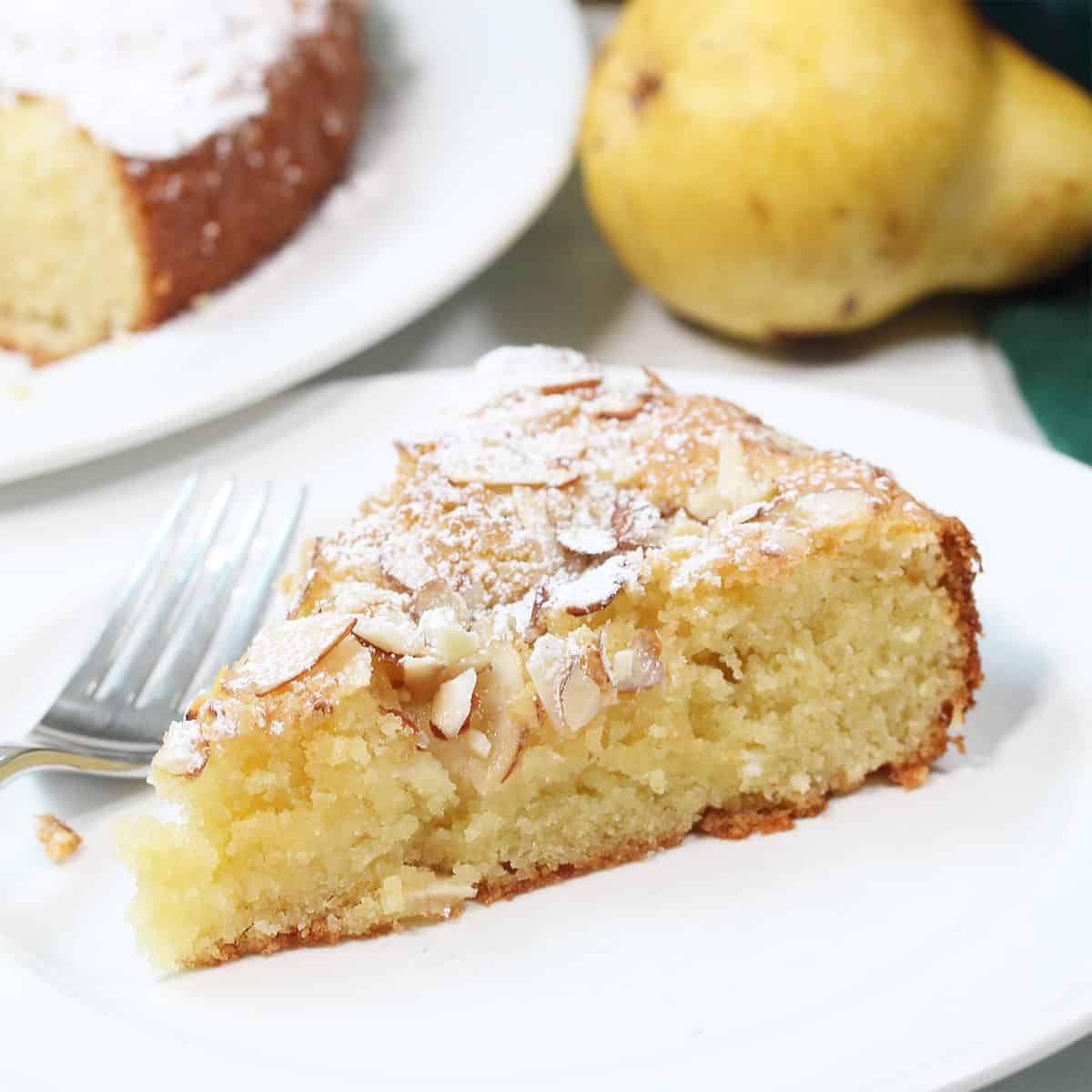 Closeup of slice of cake on plate with fork.