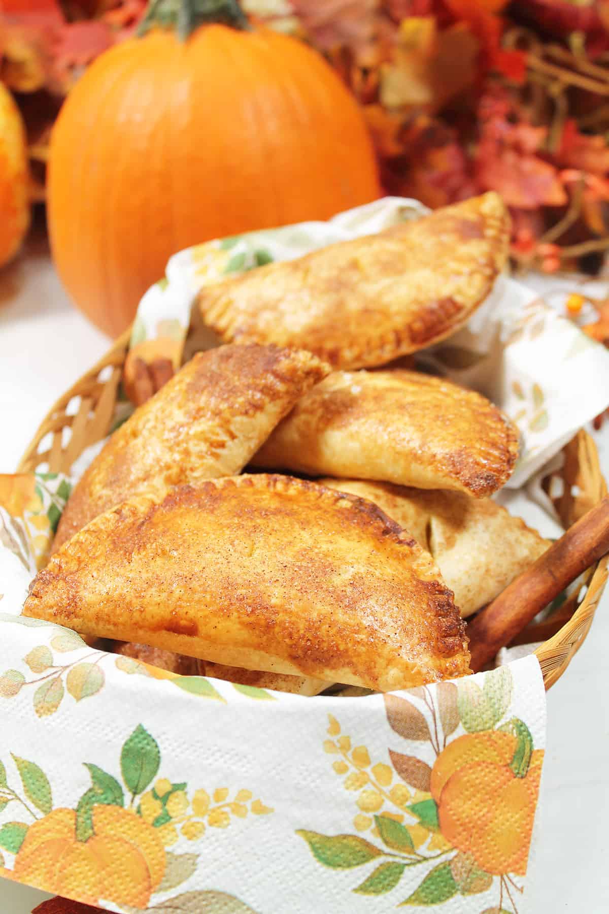 Cinnamon sugar pumpkin hand pies in basket.