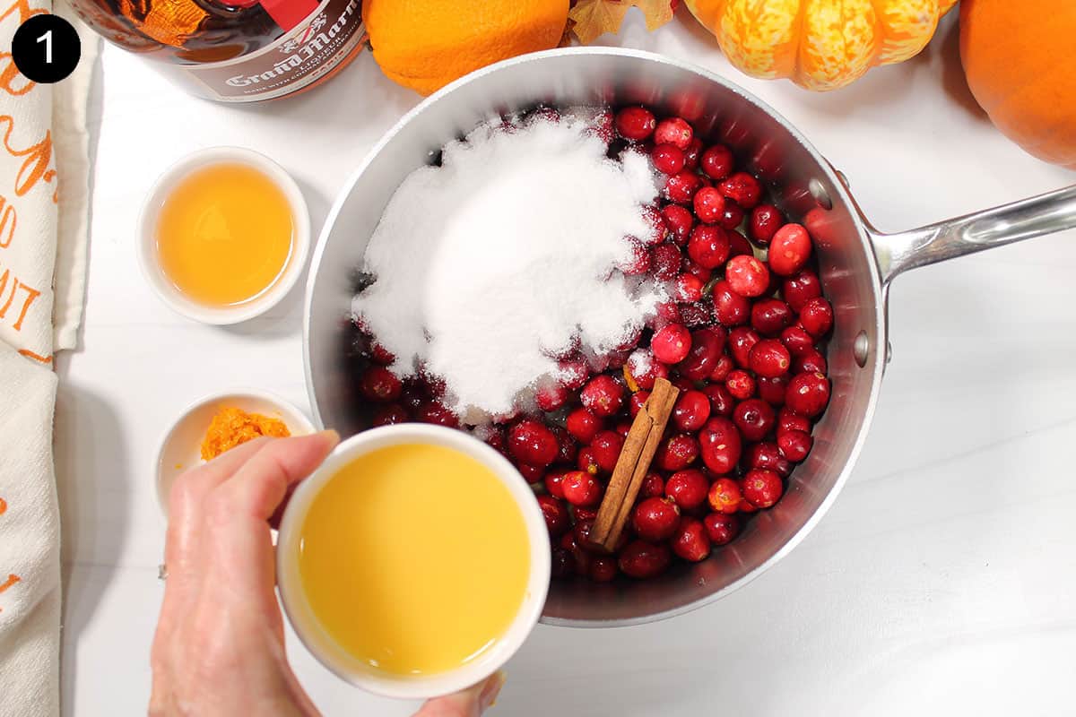 Step 1 mixing cranberry sauce ingredients together.