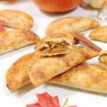 Halved hand pie showing pumpkin filling.