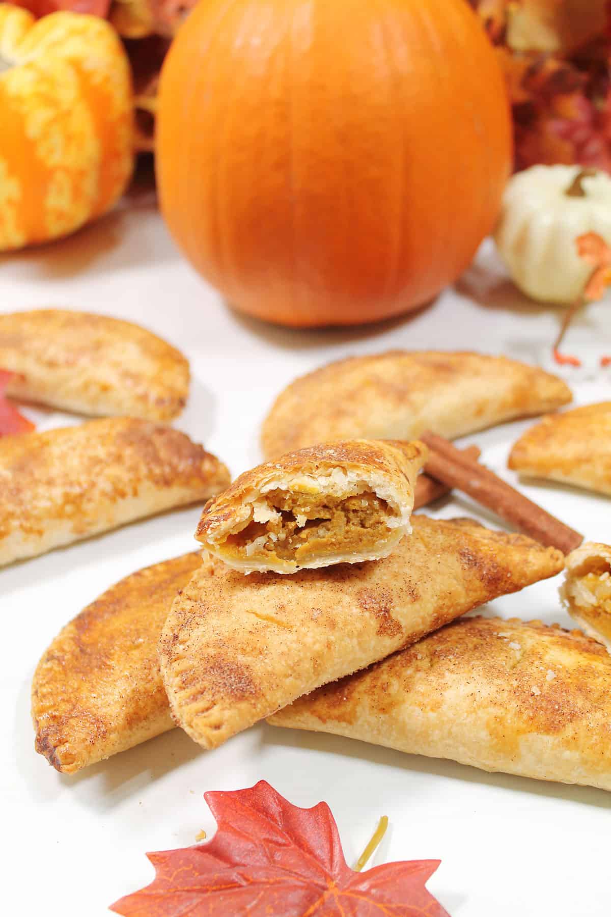 Halved pumpkin hand pie showing pumpkin filling.