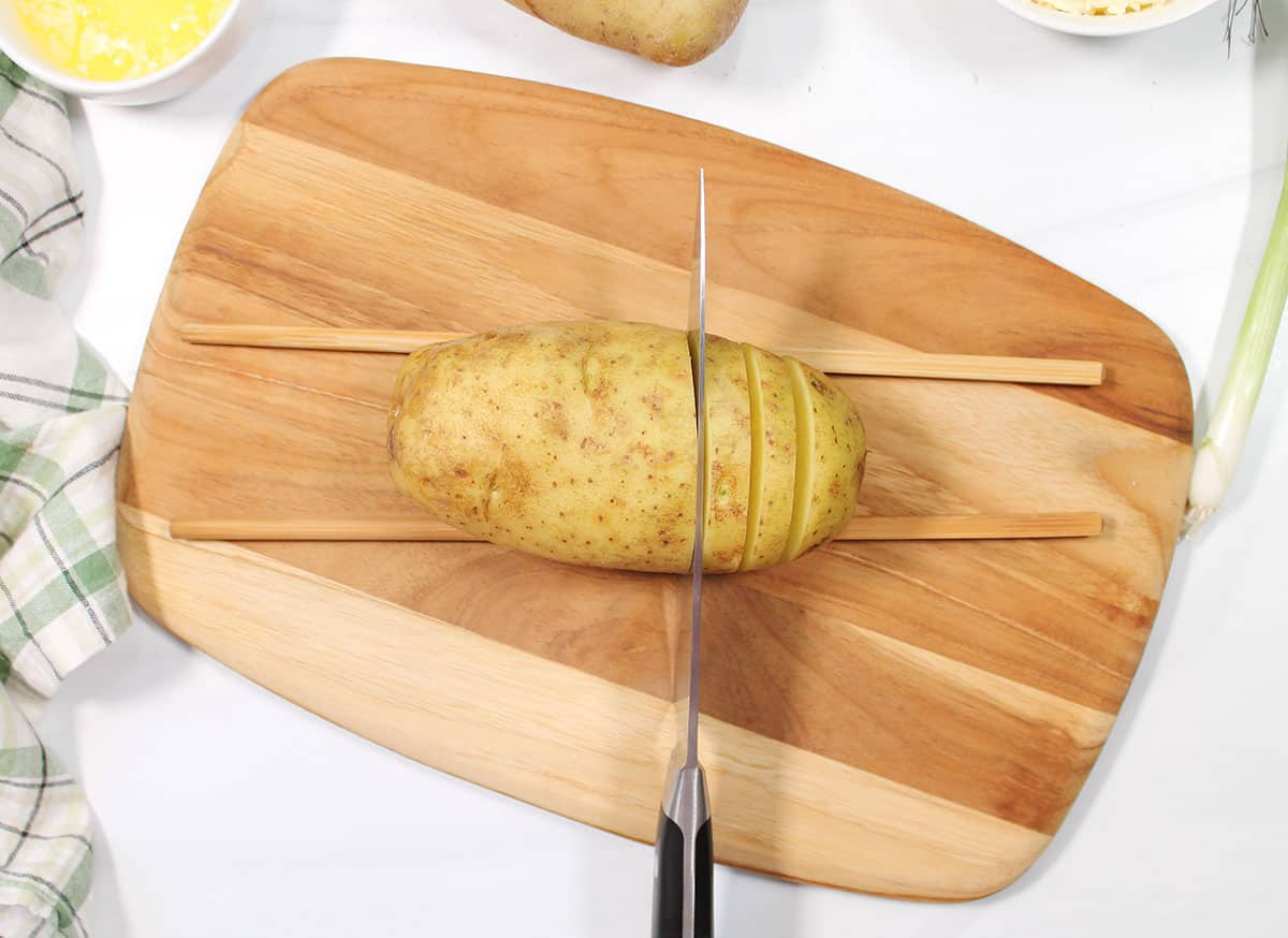 How to cut hasselback potatoes.