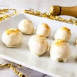 Closeup of champagne truffles with gold glitter.