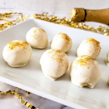 Closeup of champagne truffles with gold glitter.