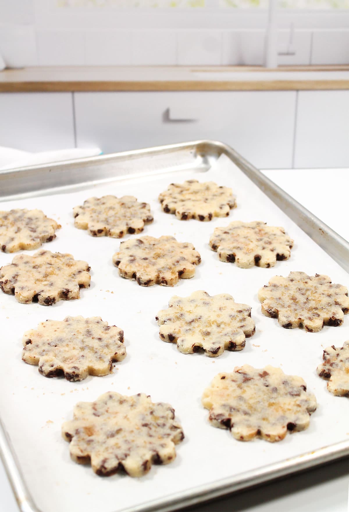 Baked cookies cooling on cookie sheet.