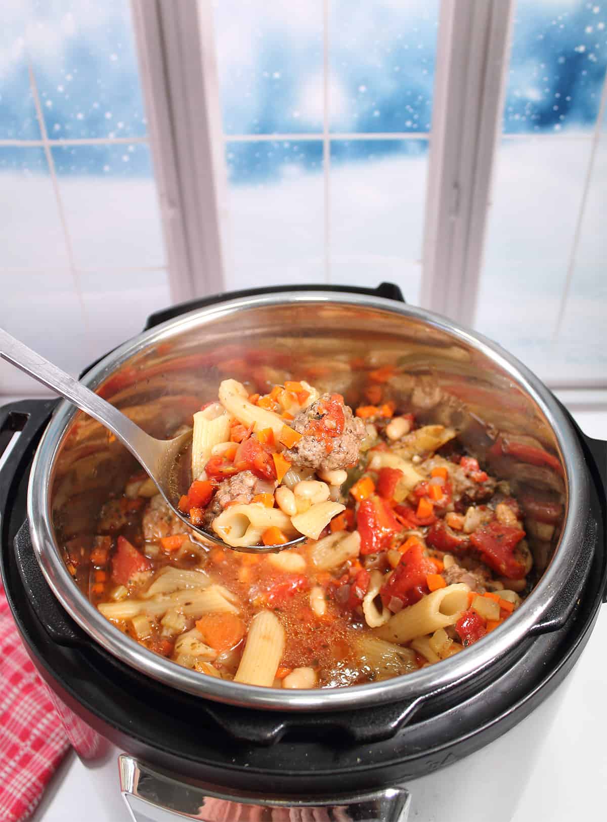 Ladle of soup over crockpot.
