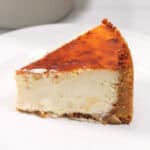 Slice of cheesecake on plate.