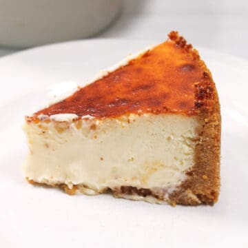 Slice of cheesecake on plate.