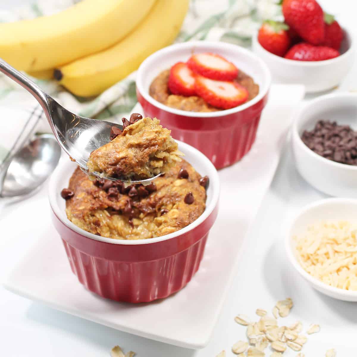 Spoonful of baked oats with chocolate chips.