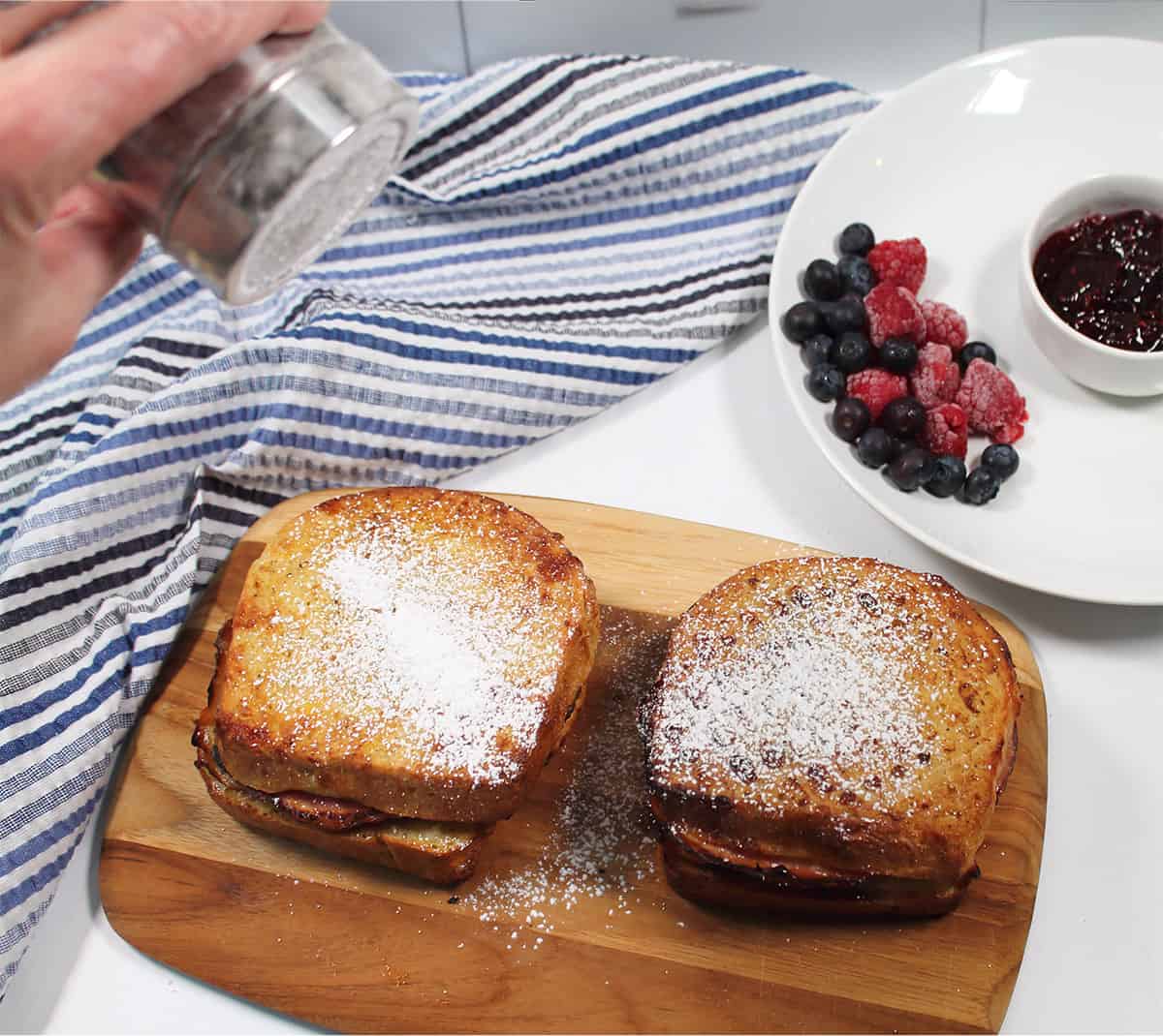 Dusting air fried sandwich with powdered sugar.