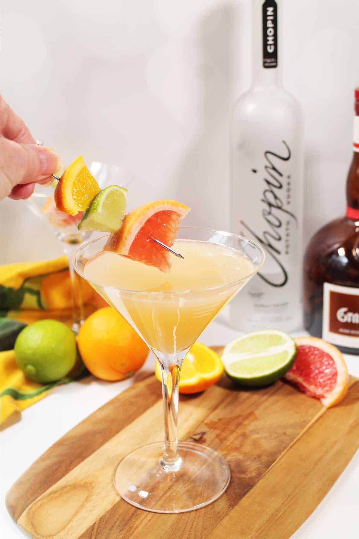 Adding garnish to finished drink.
