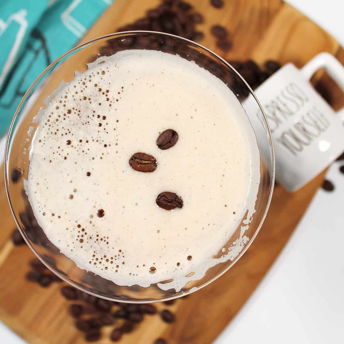 Martini topped with three coffee beans.