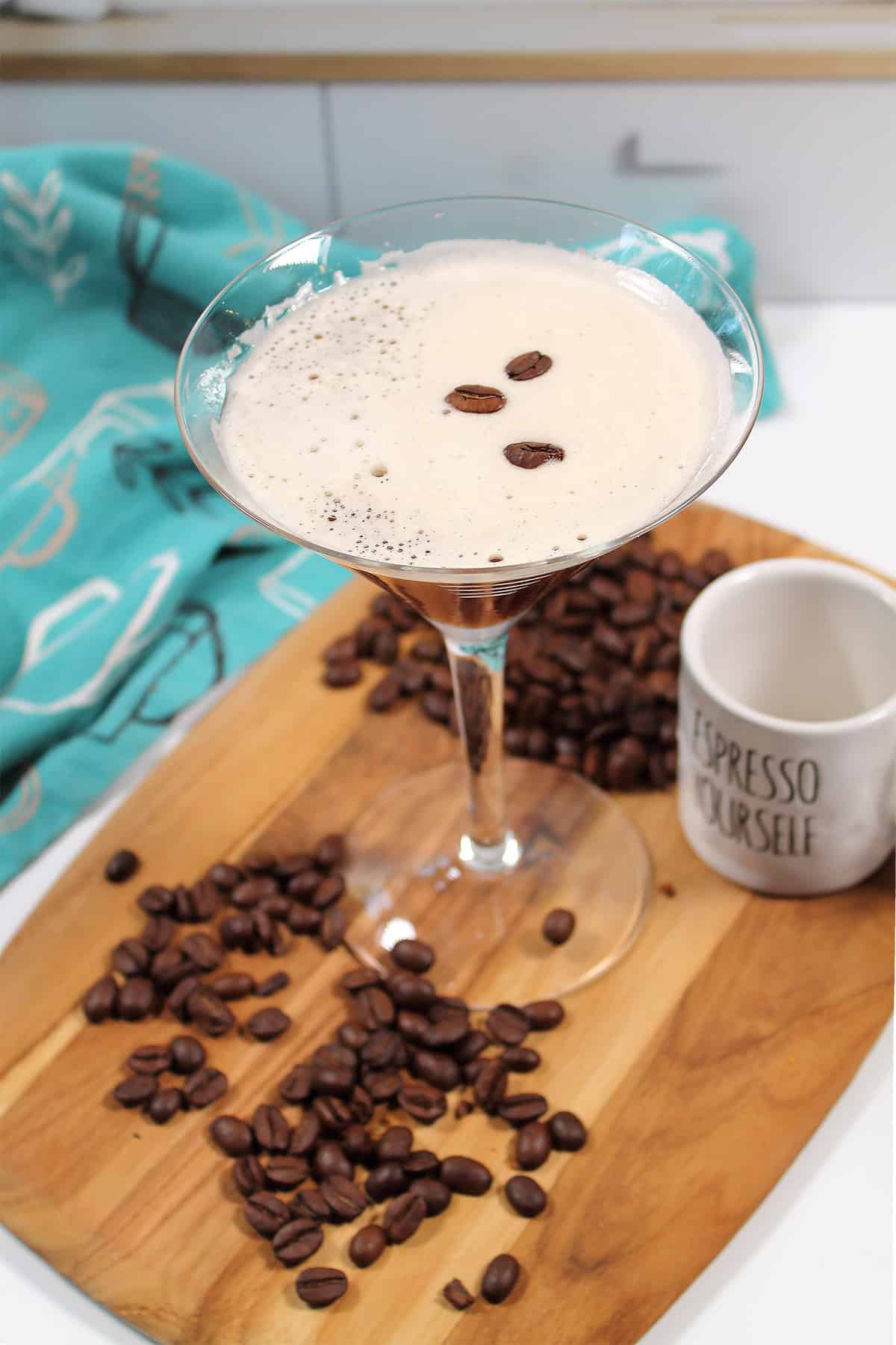 Overhead of martini showing foam and coffee bean garnish.