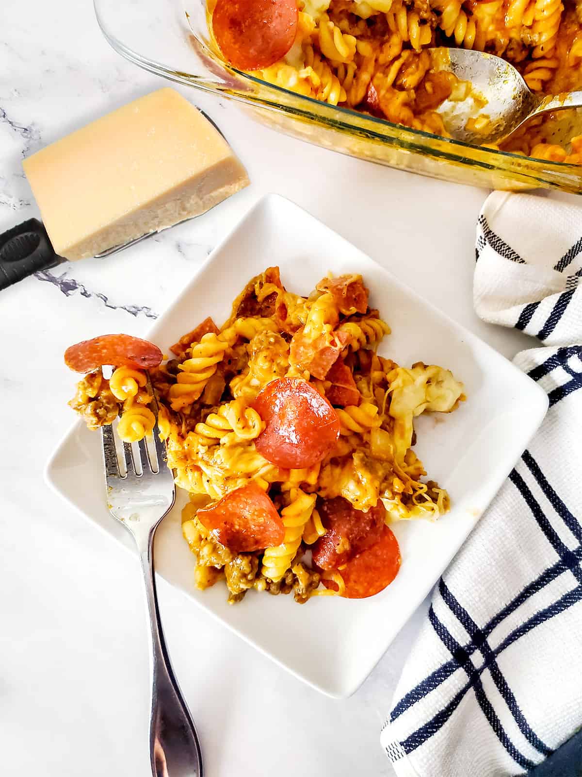 Pizza pasta on serving plate.