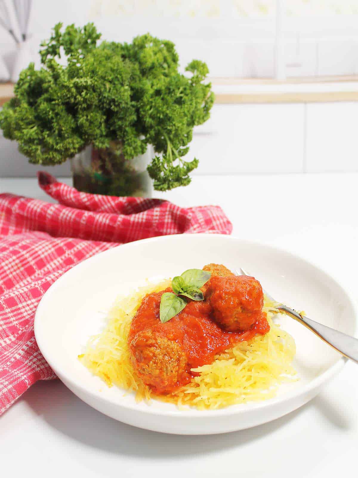Spaghetti squash and meatball dinner in bowl.