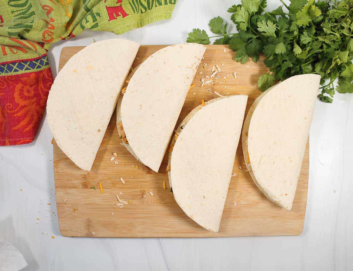 Quesadillas folded and ready to cook.