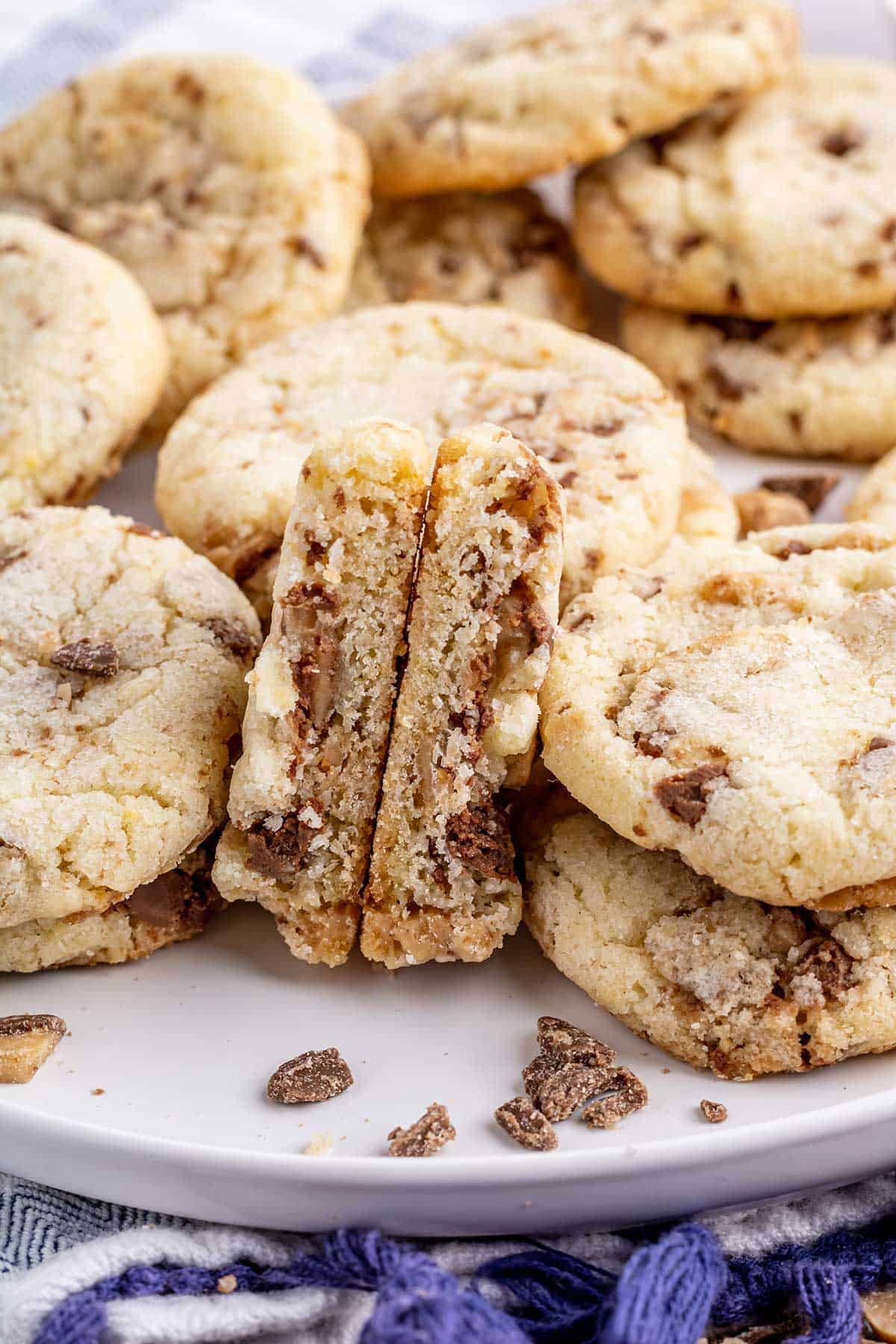 Cookies on plate with one cut to show inside.