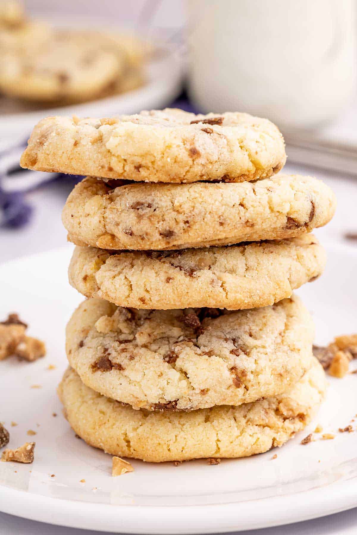 A stack of Heath Bar Cookies on white plate.