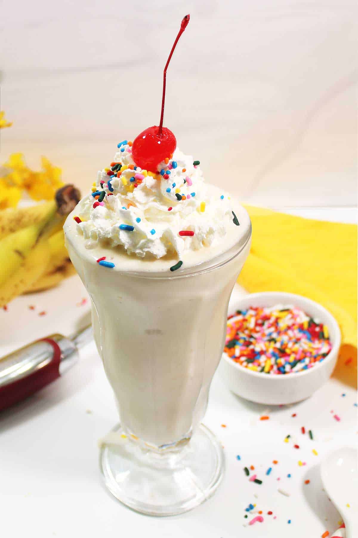 Closeup of garnished banana milkshake.