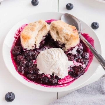 Closeup of serving in bowl with scoop of ice cream.