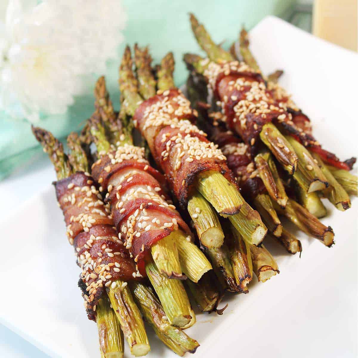 Closeup of air fried asparagus on platter.