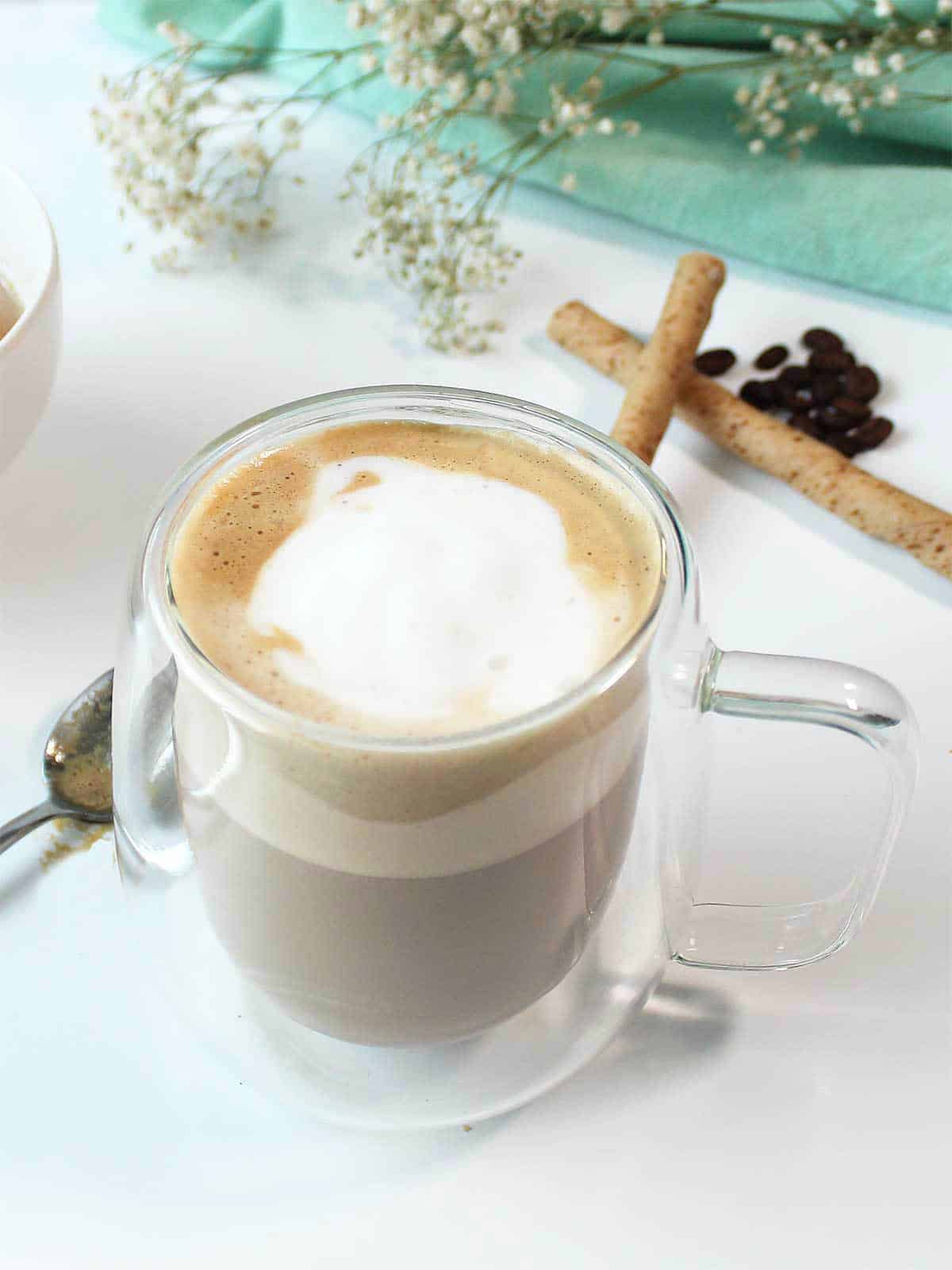 Closeup of latte showing foam on top.