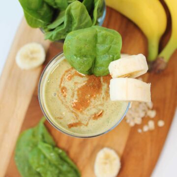 Overhead of oatmeal smoothie with sprinkle of cinnamon.