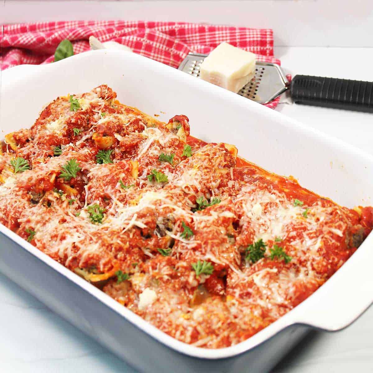 Baked stuffed shells with ground beef casserole.