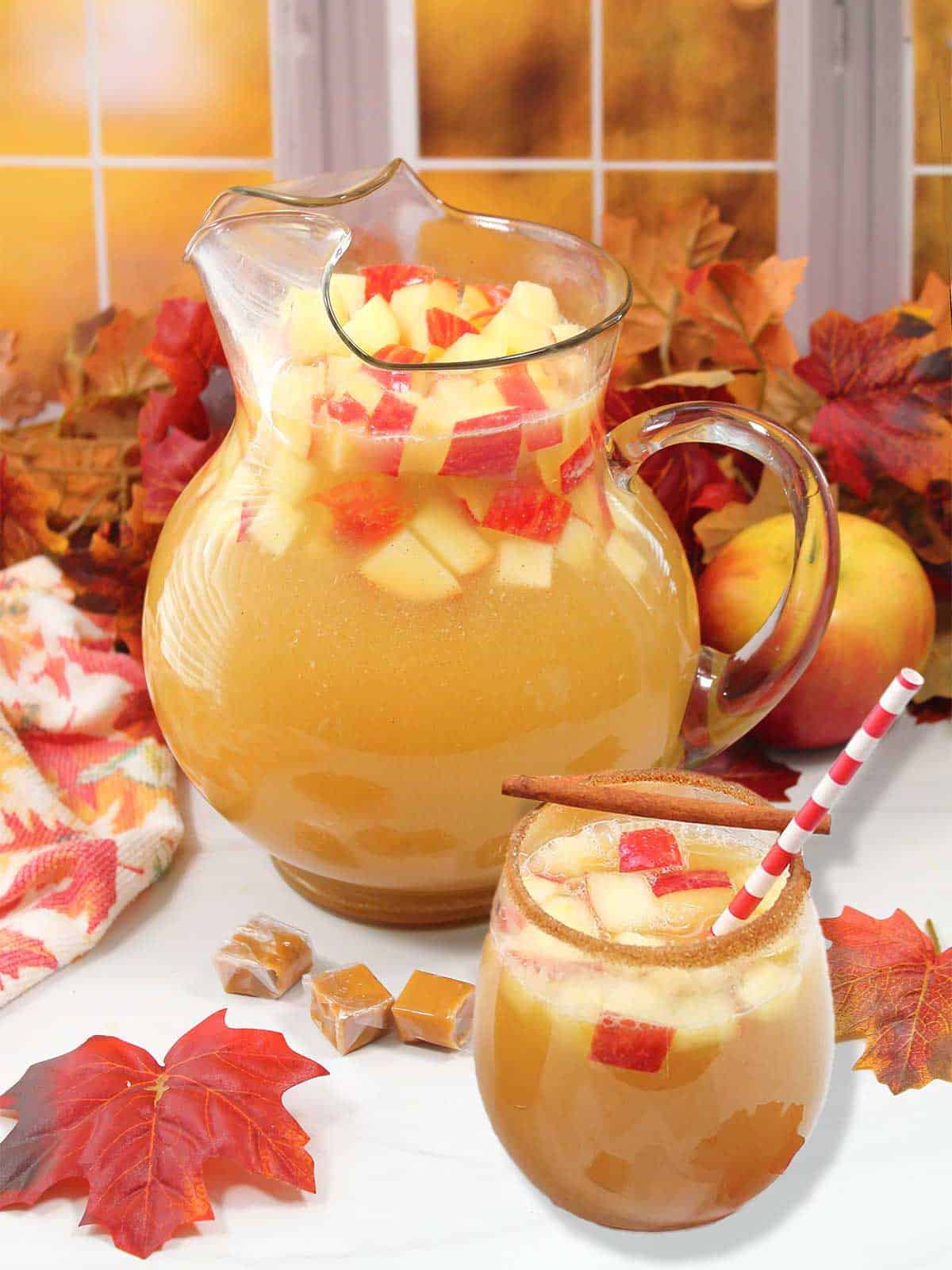 Caramel Apple Sangria in pitcher and in cocktail glass.