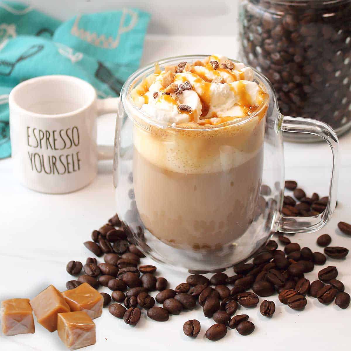 Creme Brulee Latte by jar of espresso beans.