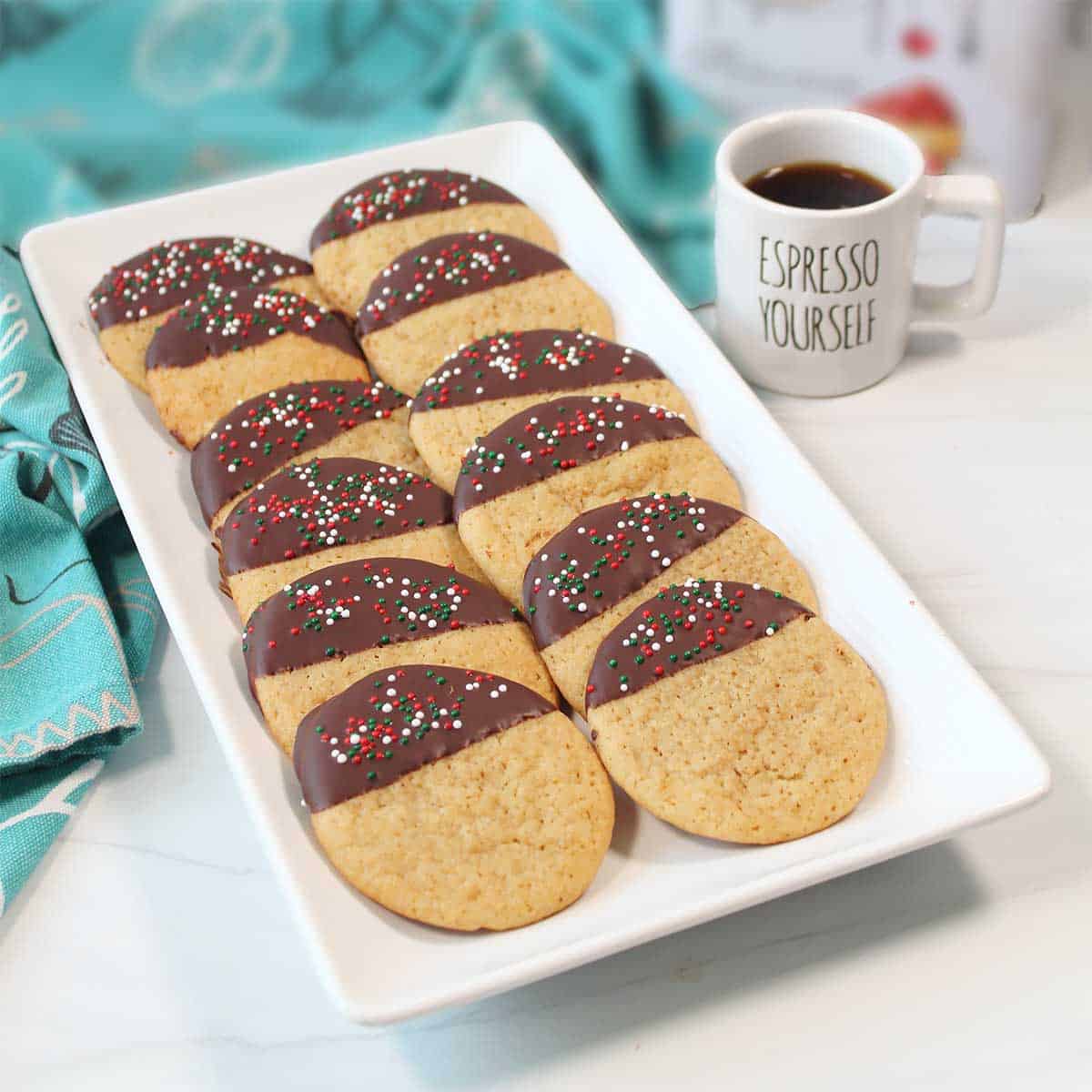 Coffee cookies on platter with cup of espresso.