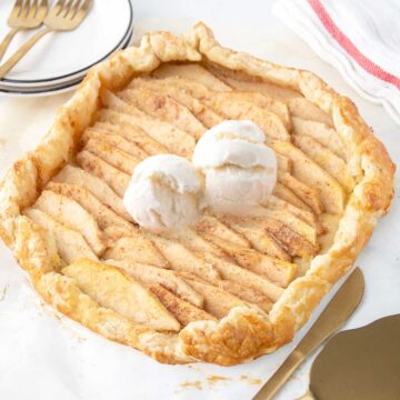 Apple Puff Pastry Galette with scoops of ice cream on top.