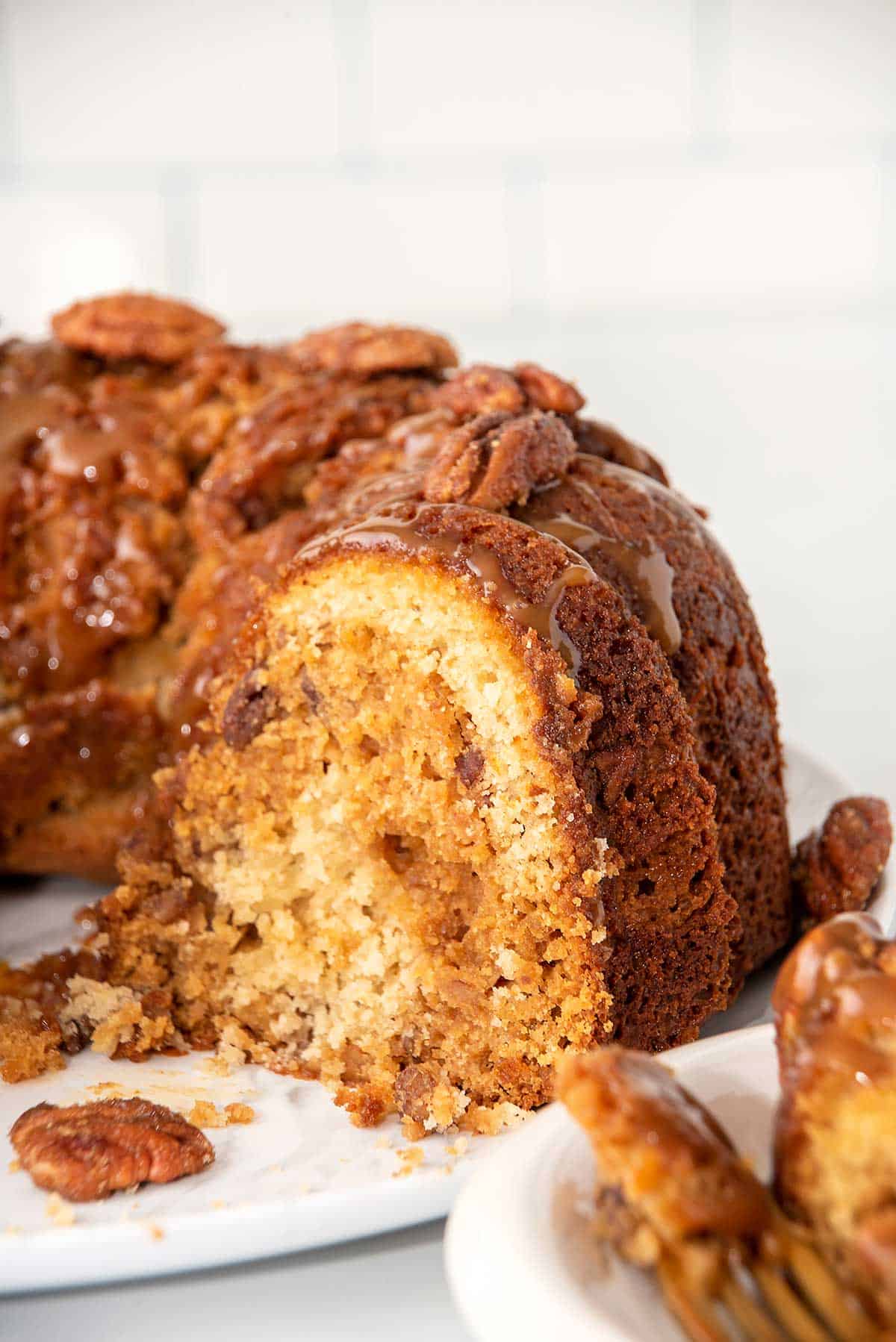 Cut pecan pie pound cake showing moist inside.