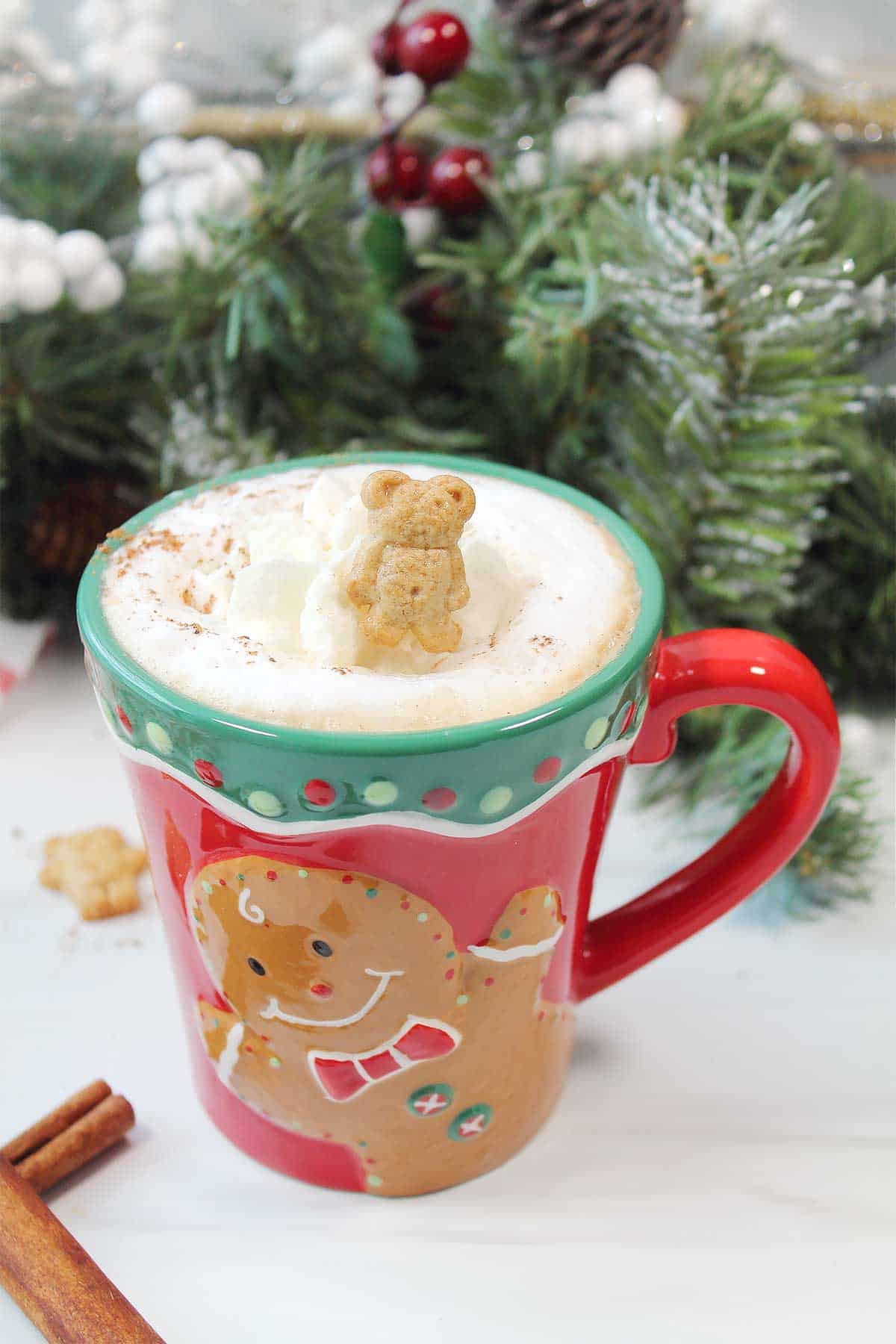 Gingerbread latte garnished with gingerbread man.