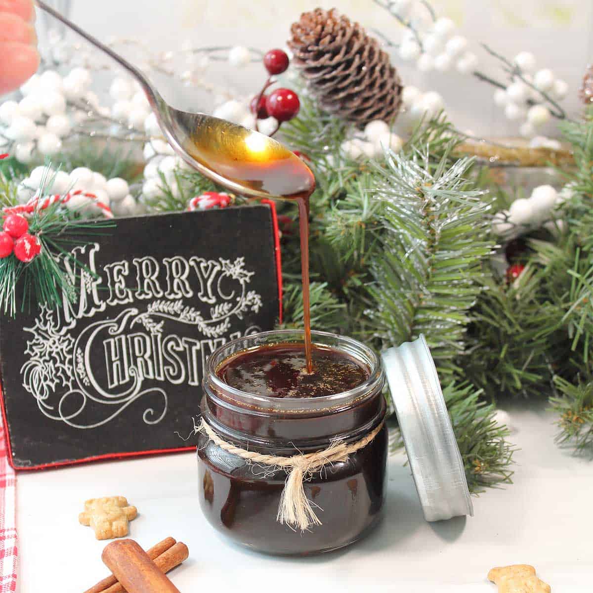 Gingerbread syrup in jar by Christmas garland.