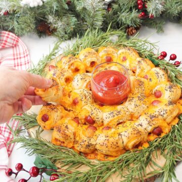 Pulling off one of the pigs in a blanket.