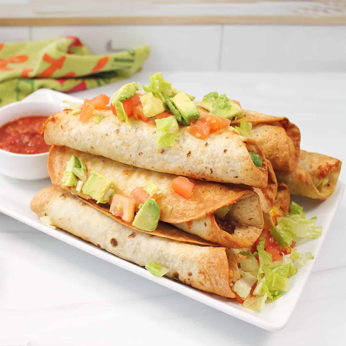Air fried breakfast taquitos closeup.