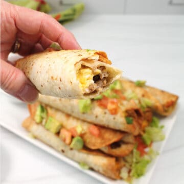 Taquitos with bite out of it.