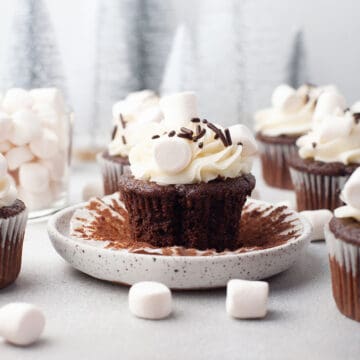 Frosted hot chocolate cupcake with wrapper pulled back.