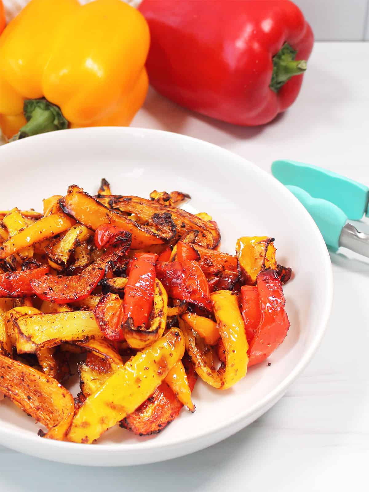 Partial view of fried peppers in a bowl.