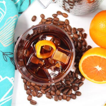 Cocktail surrounded by coffee beans.