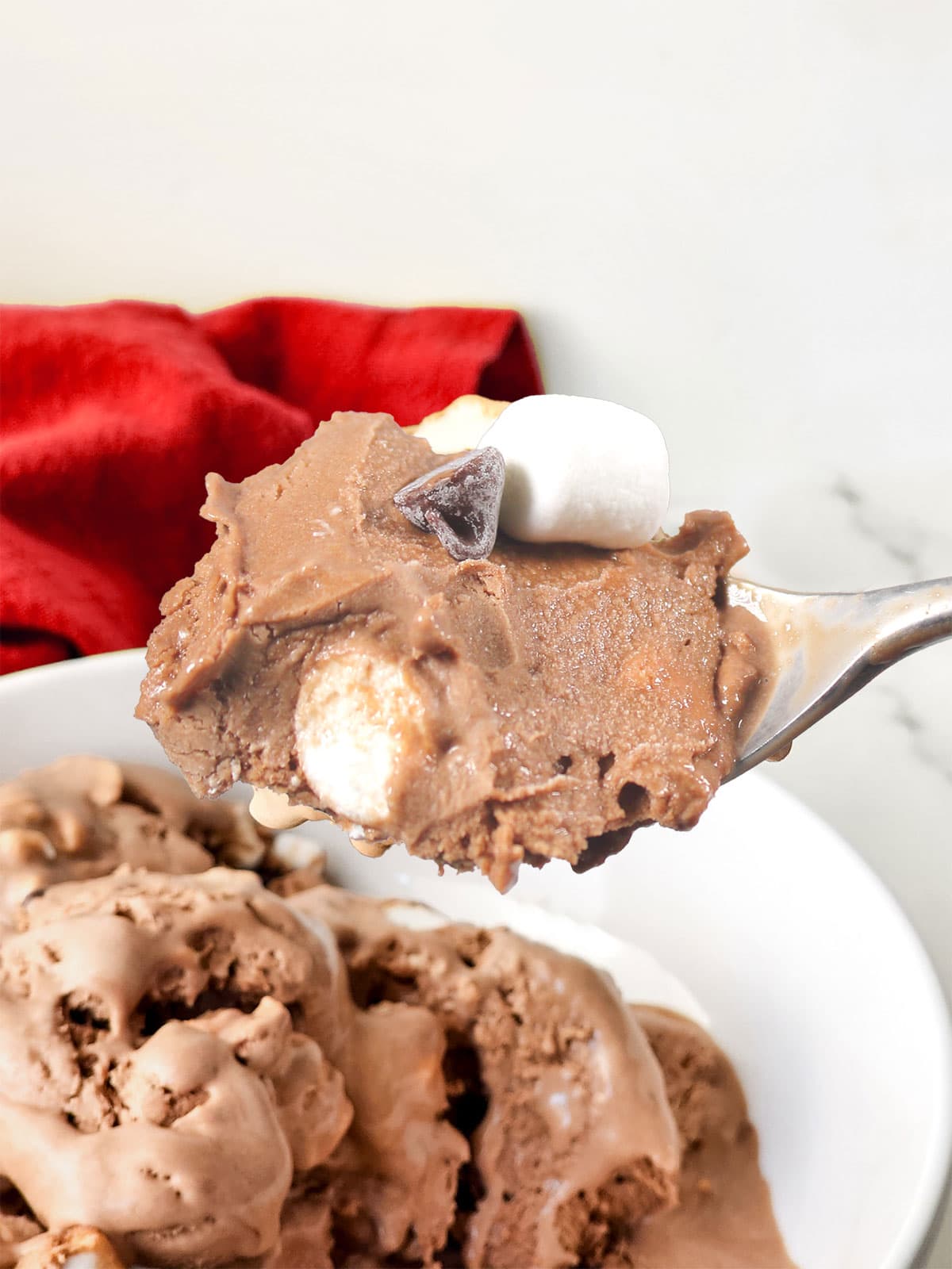 Hot chocolate ice cream on spoon closeup.