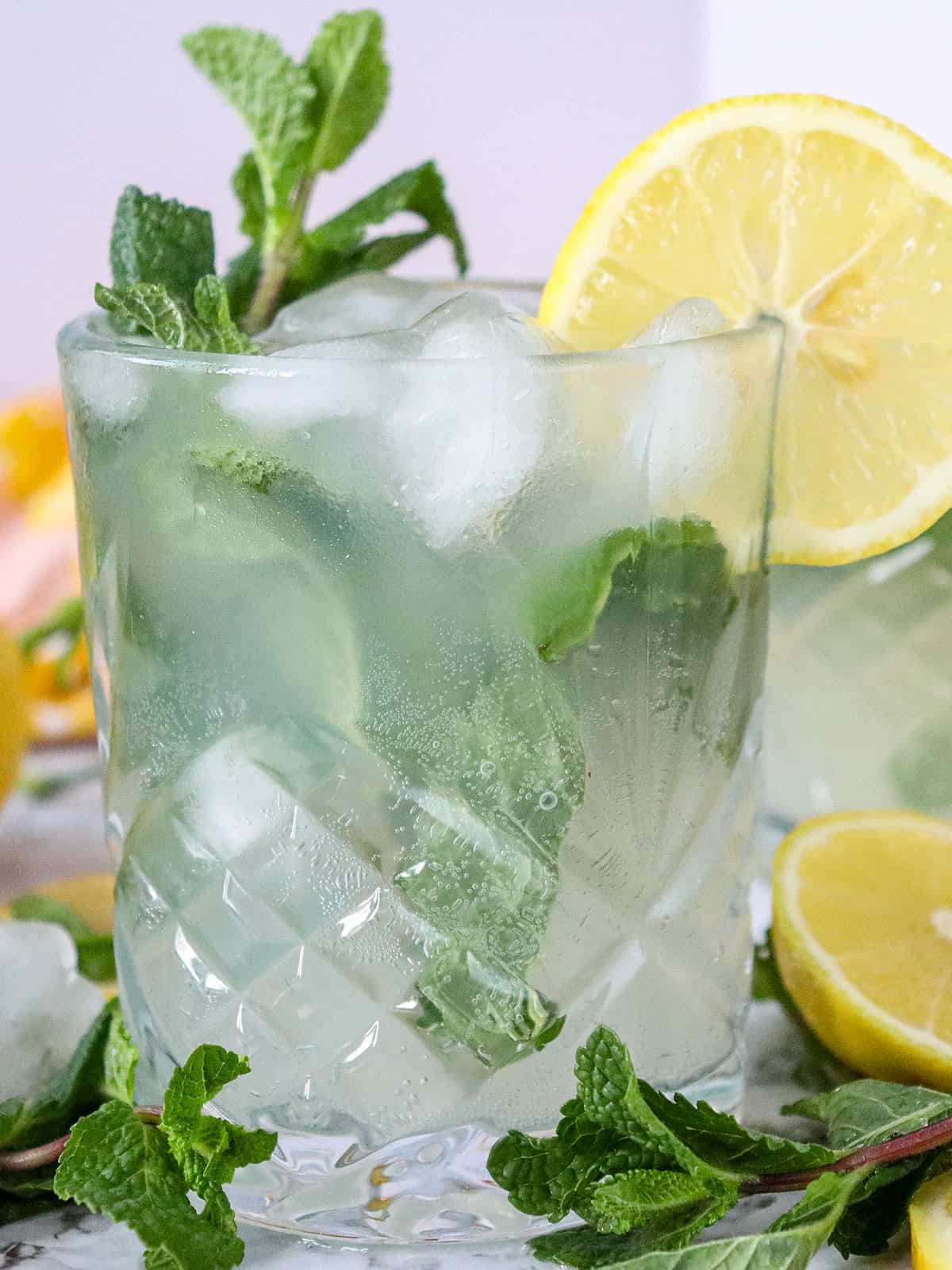 Single mocktail with mint garnish.
