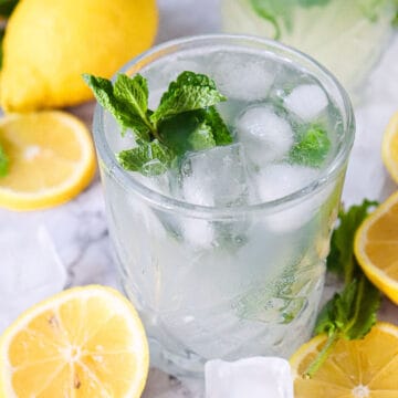 Mojito mocktail garnished with mint.