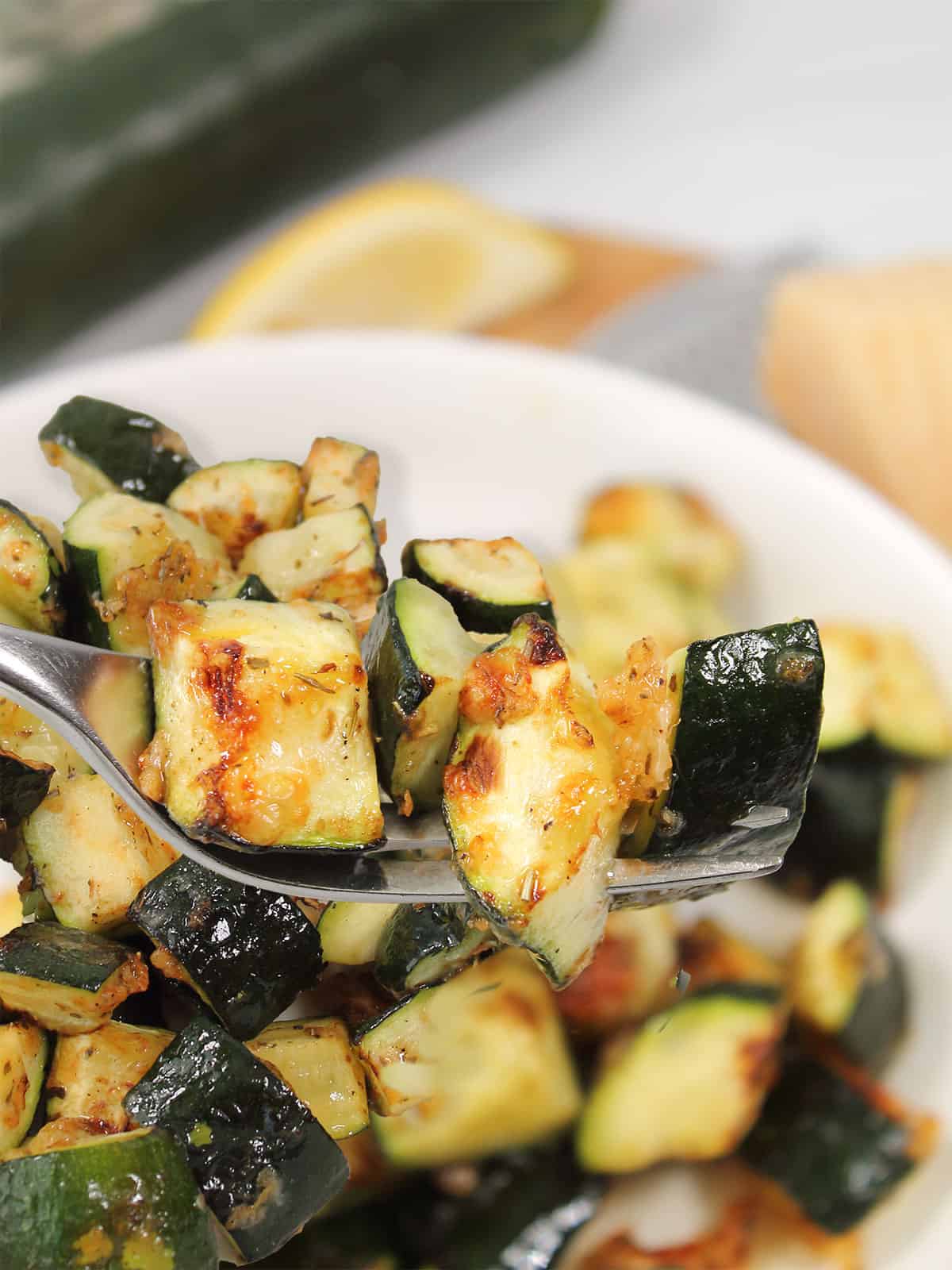 Parmesan zucchini on fork.