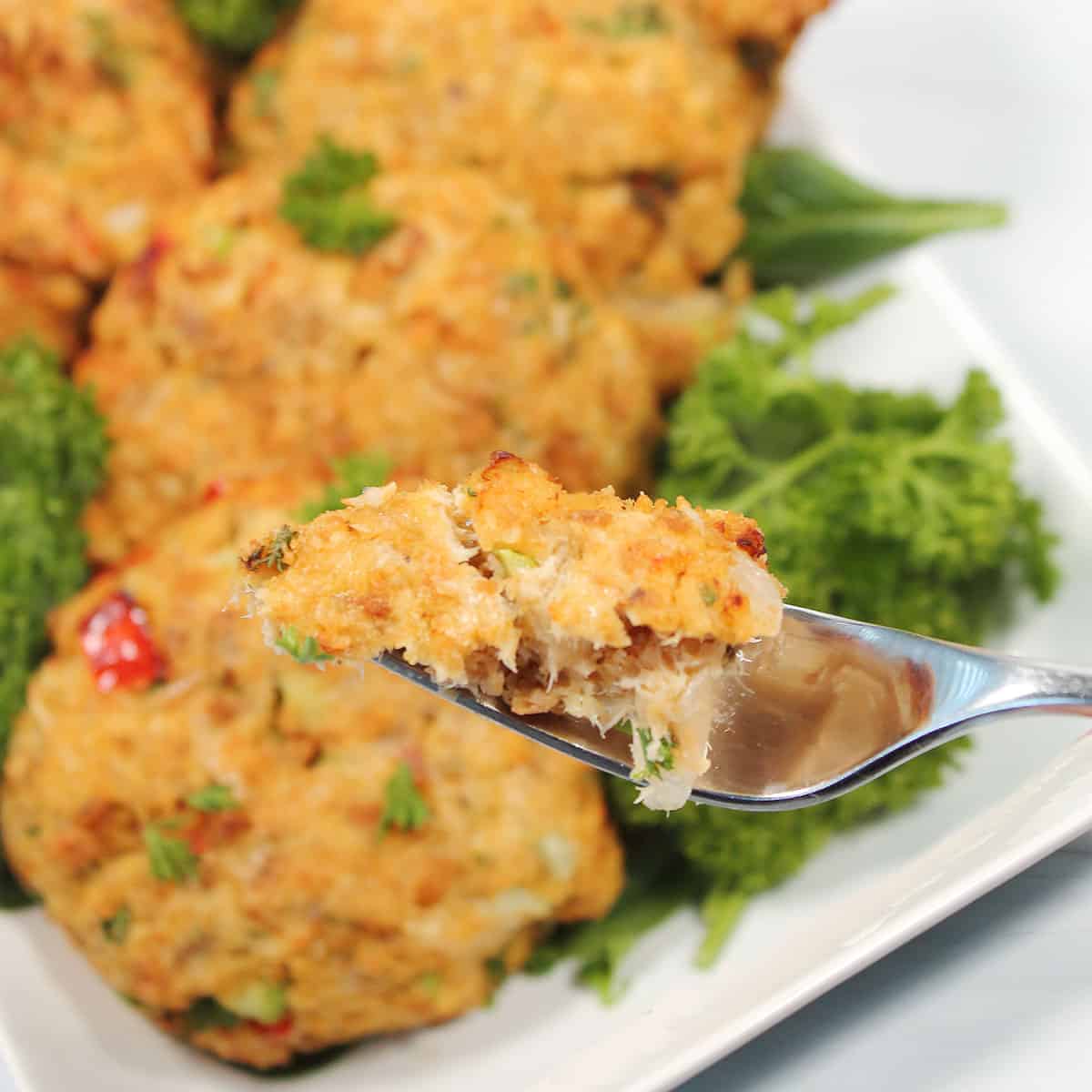 Bite of air fryer salmon burger on fork.