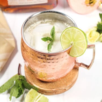 Kentucky Mule on coaster with lime slice garnish.