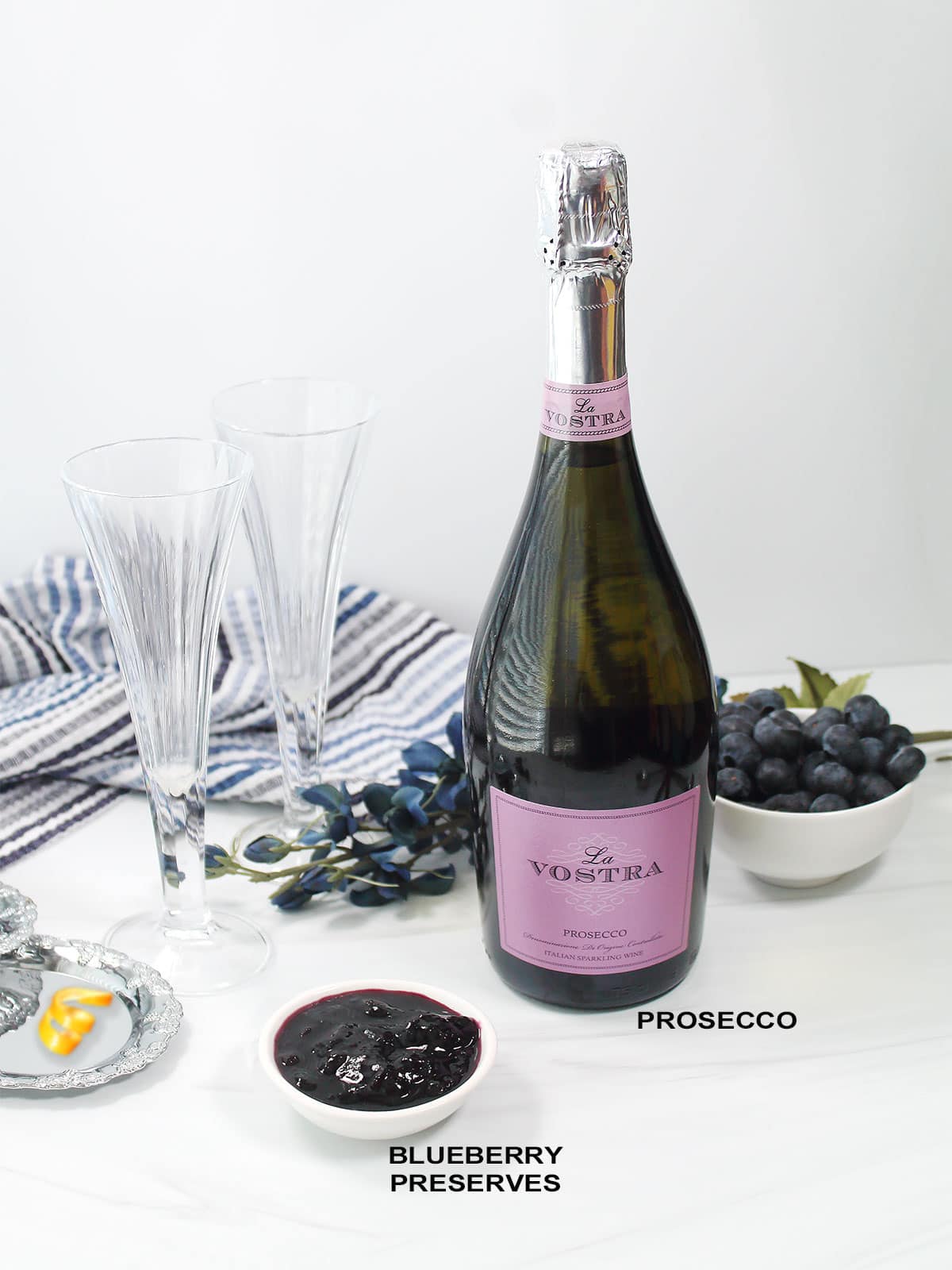 Ingredients for 2 ingredient blueberry bellini.